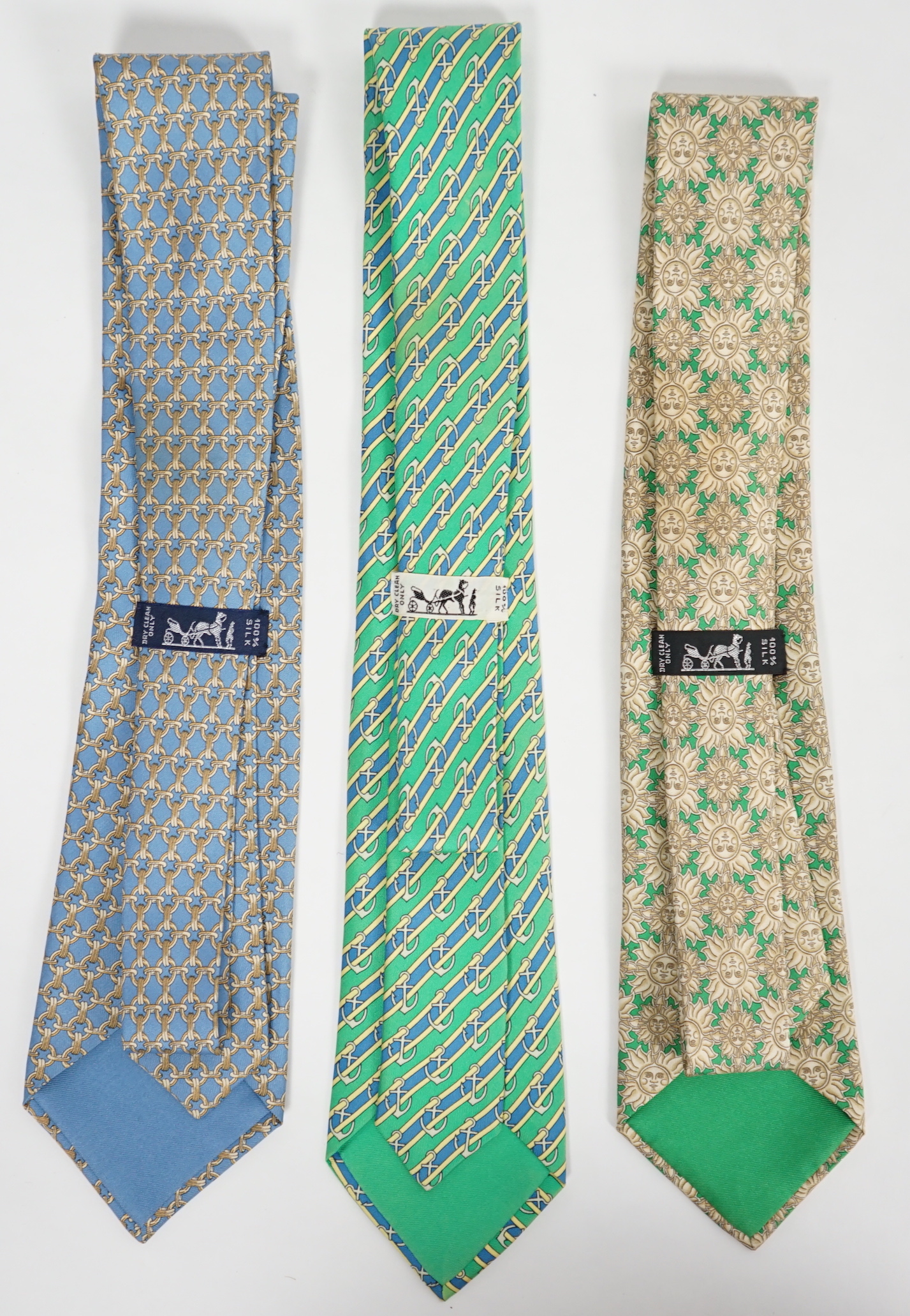 Three Hermès gentlemen's assorted patterned silk ties